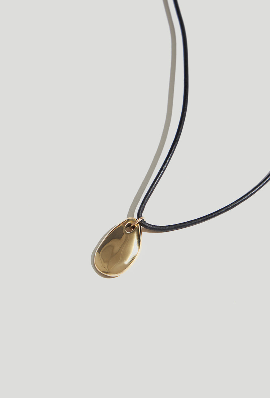 Small Pebble Pendant Necklace Gold Cord